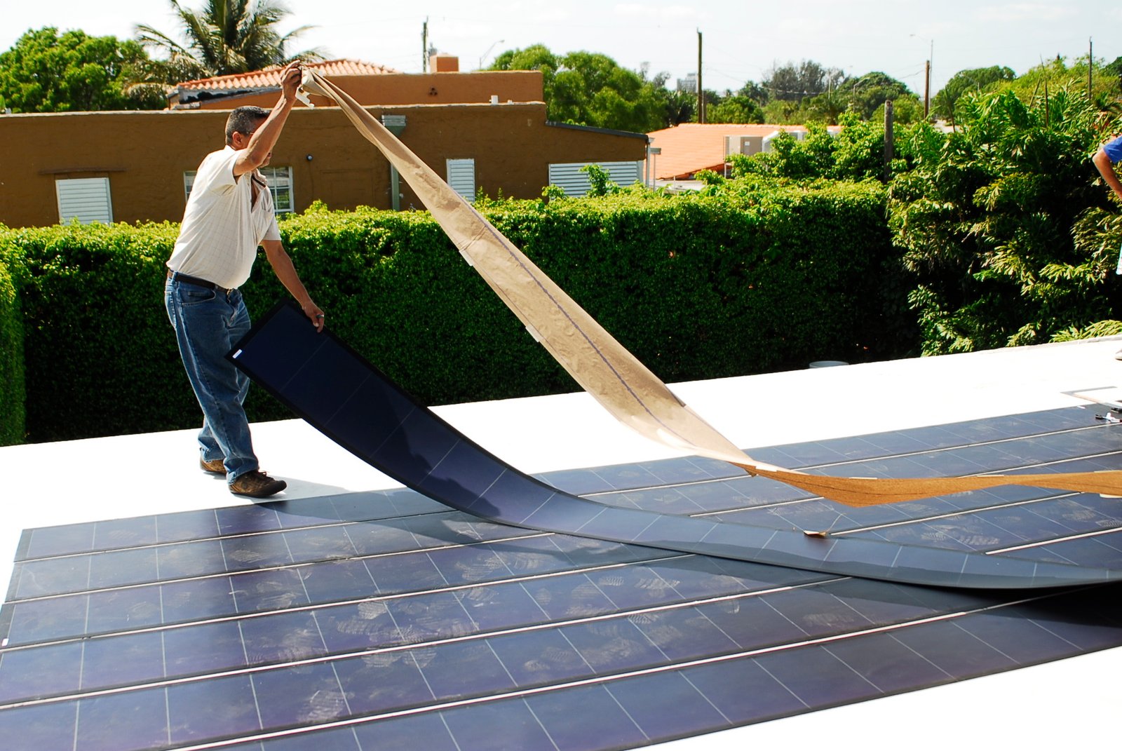 a man installing thin film solar panels