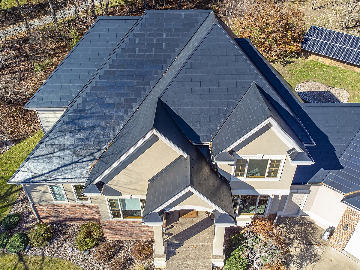 a house with solar shingles installed on roof