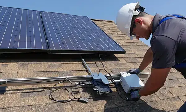 an electrician installing microinverter