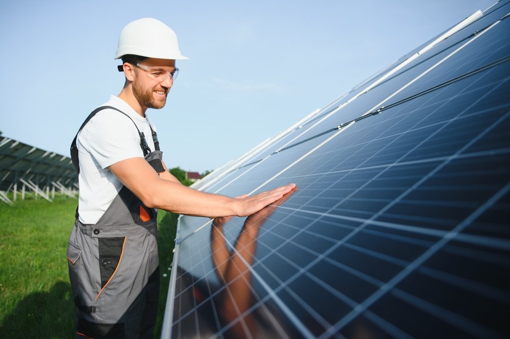 engineer checking quality of soalr panels